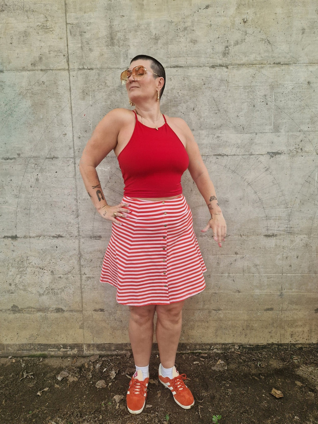 Popper Skirt Mini in Tomato Red on Bubblegum pink!  - Manners London