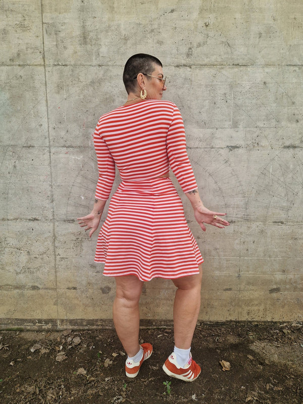 Popper Skirt Mini in Tomato Red on Bubblegum pink!  - Manners London