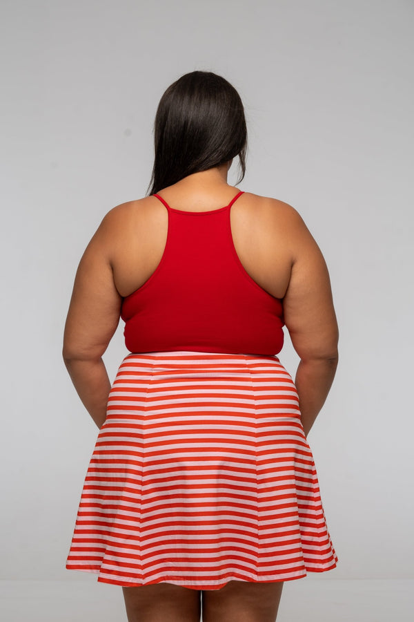 Popper Skirt Mini in Tomato Red on Bubblegum pink!  - Manners London