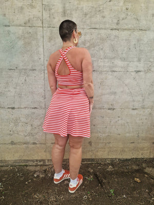 Popper Skirt Mini in Tomato Red on Bubblegum pink!  - Manners London