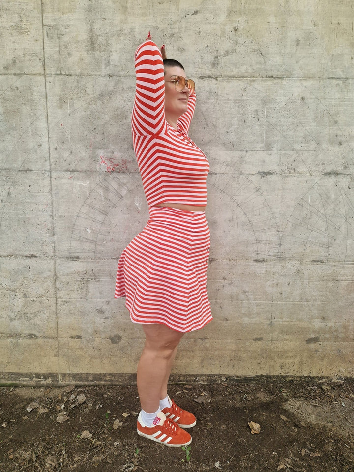 Popper Skirt Mini in Tomato Red on Bubblegum pink!  - Manners London