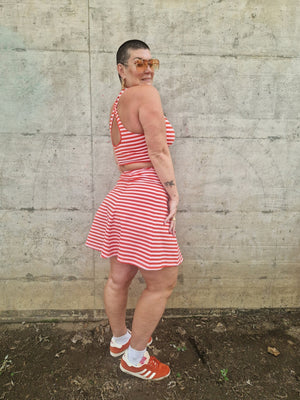 Popper Skirt Mini in Tomato Red on Bubblegum pink!  - Manners London