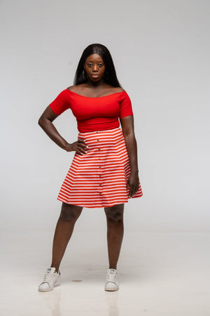 Popper Skirt Mini in Tomato Red on Bubblegum pink!  - Manners London