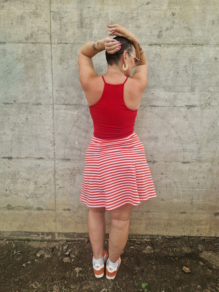 Popper Skirt Mini in Tomato Red on Bubblegum pink!  - Manners London