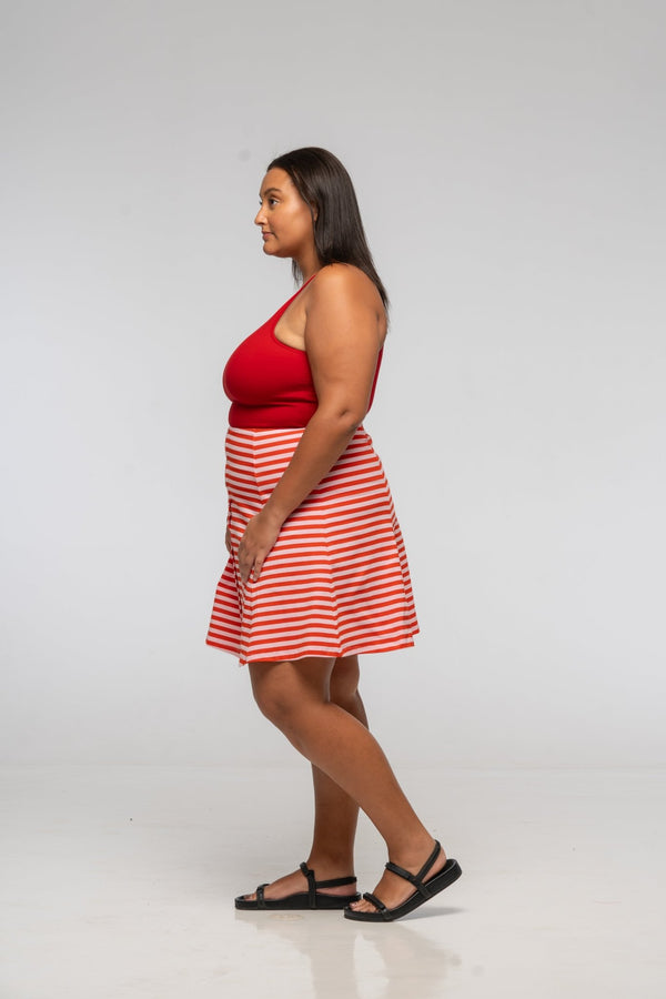 Popper Skirt Mini in Tomato Red on Bubblegum pink!  - Manners London