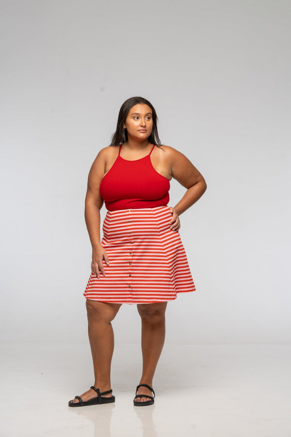 Popper Skirt Mini in Tomato Red on Bubblegum pink!  - Manners London