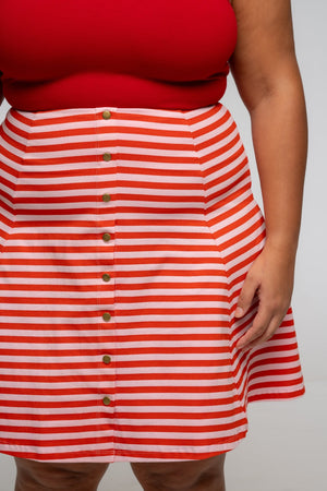 Popper Skirt Mini in Tomato Red on Bubblegum pink!  - Manners London