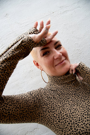Turtle Neck Long Sleeve Crop Top with Hole in Classic Leopard - Manners London