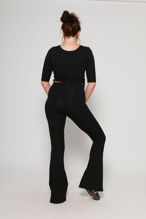 Faiza Flare Trousers Petite in Black - Manners London